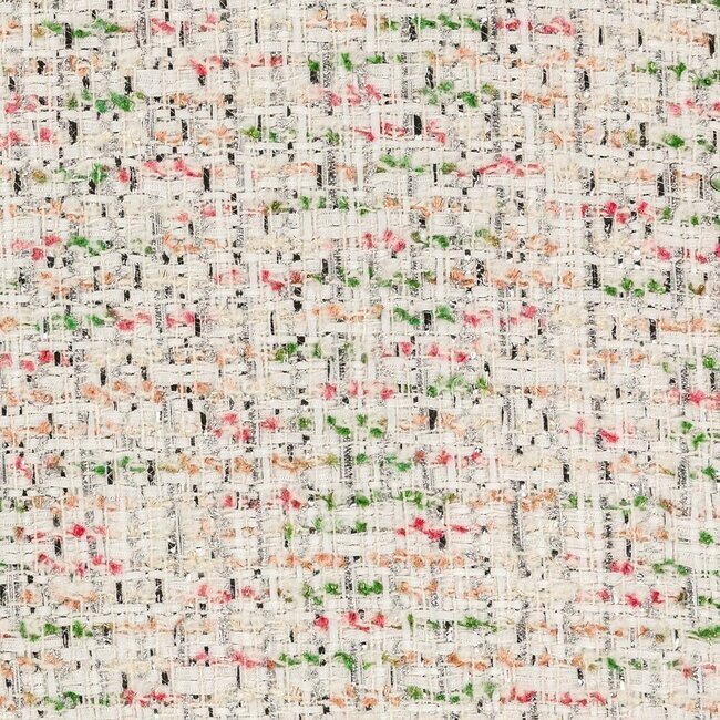 Tweed blanc neige parsemé de fils argentés. Finition sophistiquée et lumineuse.