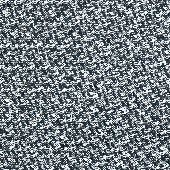 Tweed noir et blanc au motif pied-de-poule. Tissage serré et graphique.