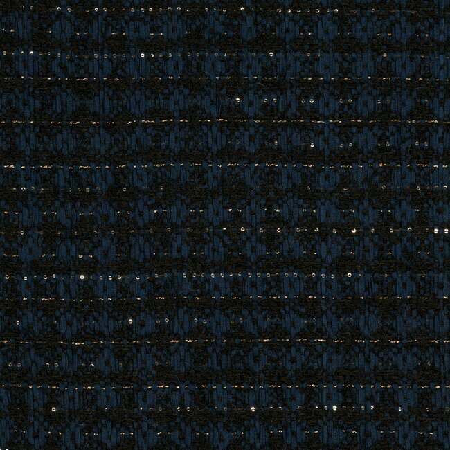 Tweed bleu profond avec tissage dense et touches d'alpaga pour plus de douceur.
