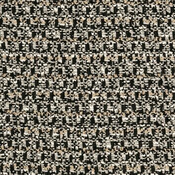 Tweed contrasté noir et blanc avec tissage graphique et reflets métallisés discrets.