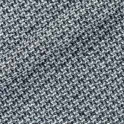 Tweed noir et blanc au motif pied-de-poule. Tissage serré et graphique.