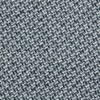 Tweed noir et blanc au motif pied-de-poule. Tissage serré et graphique.